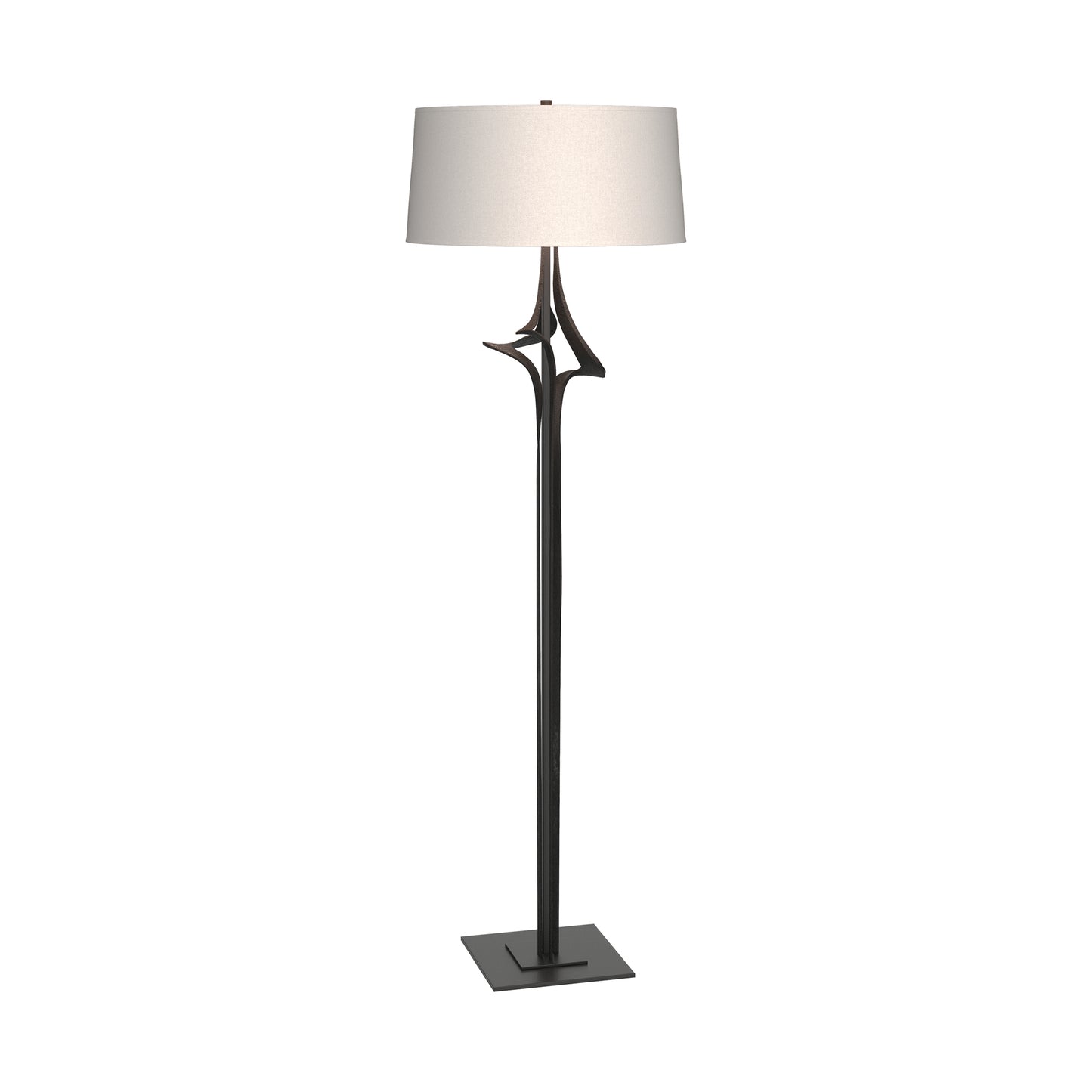 Antasia Floor Lamp by Hubbardton Forge featuring a slender black metal base and white fabric drum shade, highlighting expert craftsmanship and elegant modern design.