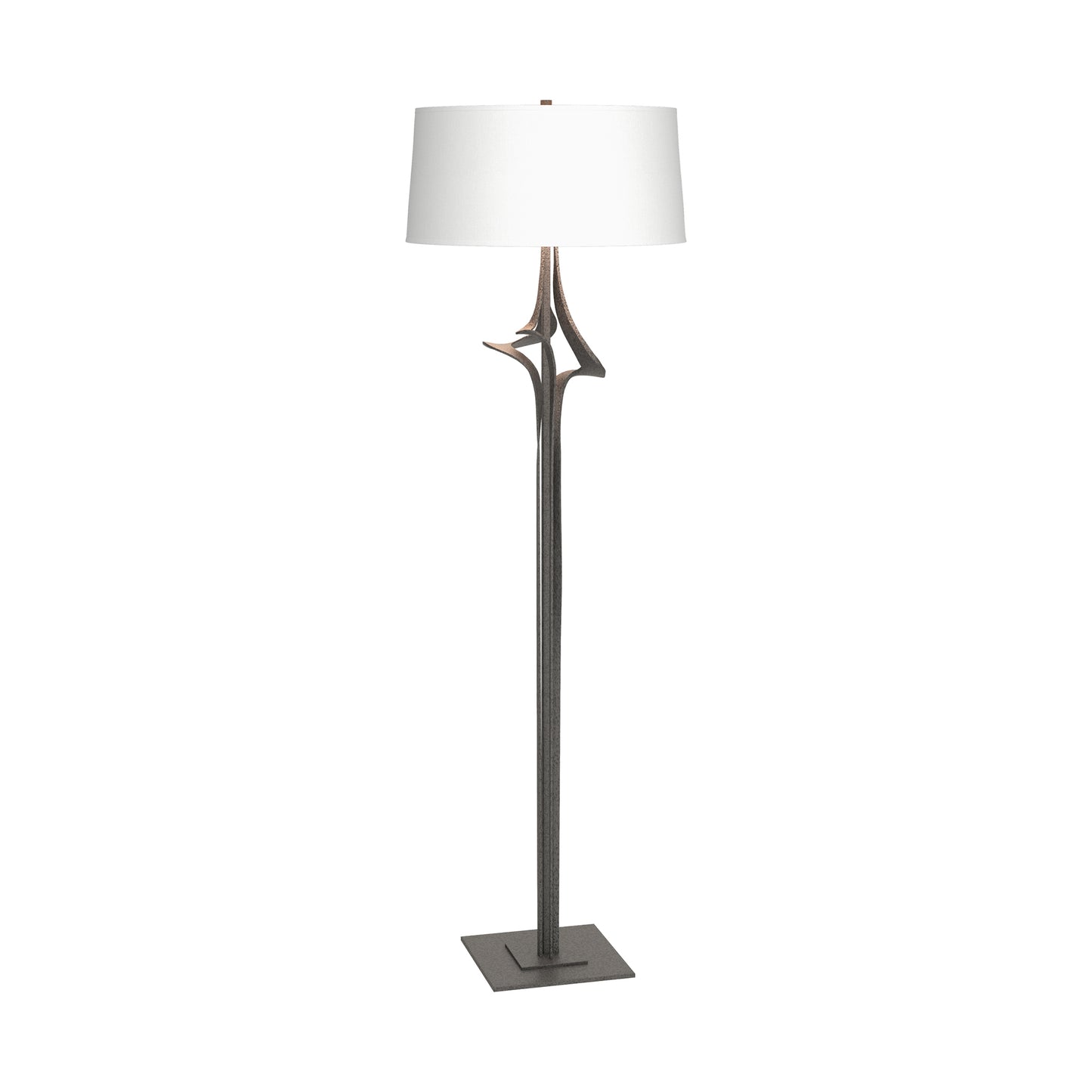 Antasia Floor Lamp by Hubbardton Forge with a white drum shade and sculpted metallic base, showcasing elegant American-made craftsmanship.