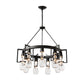 The Hubbardton Forge Apothecary Circular Chandelier, hand-blown with clear glass bulbs.