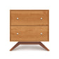 A Copeland Furniture Astrid 2-Drawer Nightstand with round white knobs standing on splayed legs against a white background.