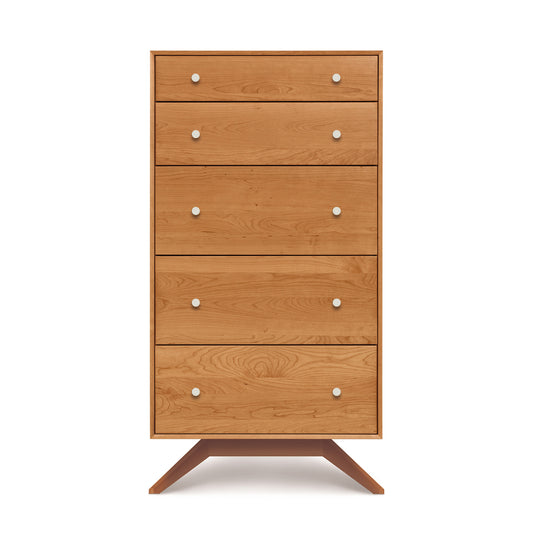 A solid cherry hardwood five-drawer chest, known as the Copeland Furniture Astrid 5-Drawer Chest, with round knobs and angled legs, isolated on a white background.