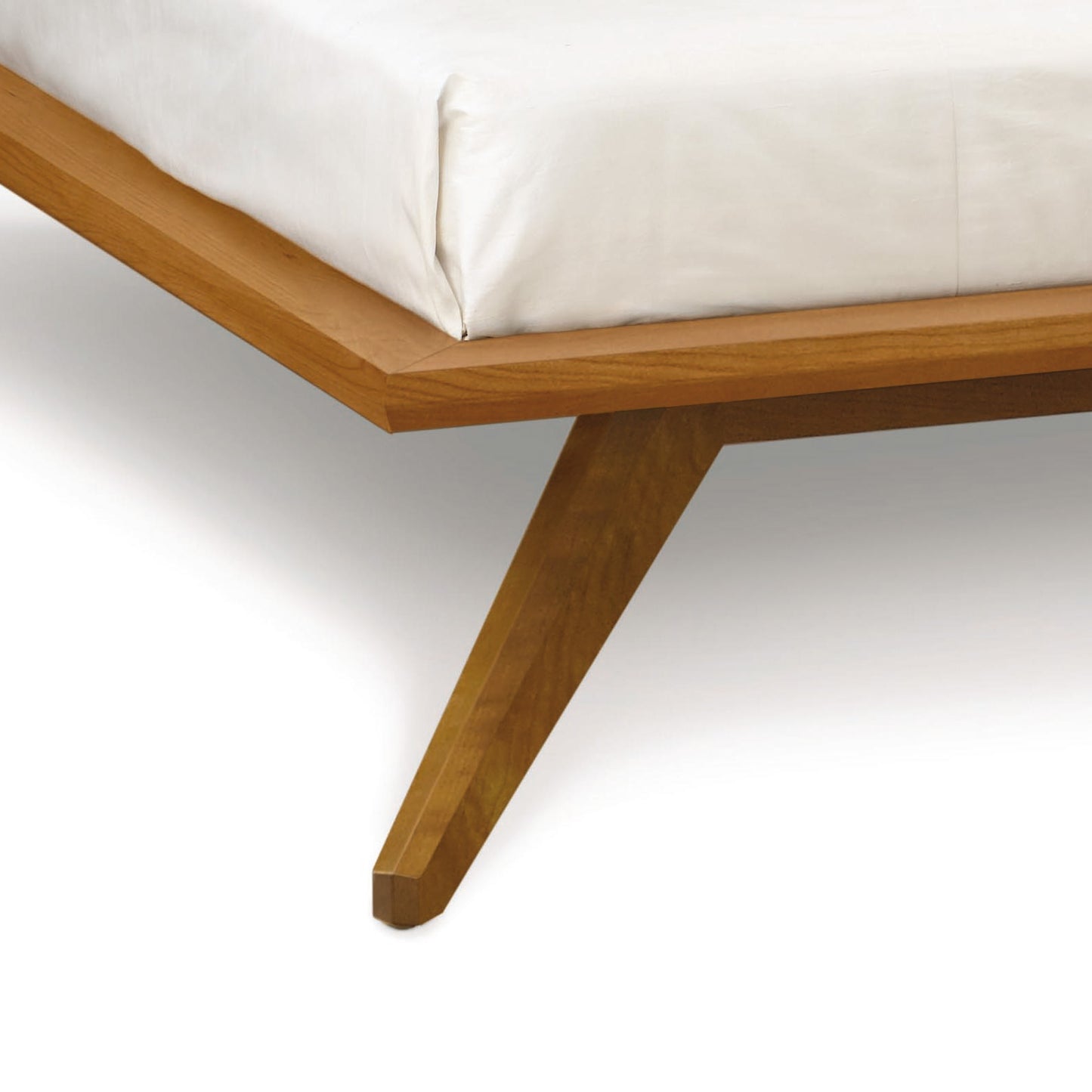 Astrid Platform Bed by Copeland Furniture featuring eco-friendly hardwood construction, white mattress, and distinct angular legs.