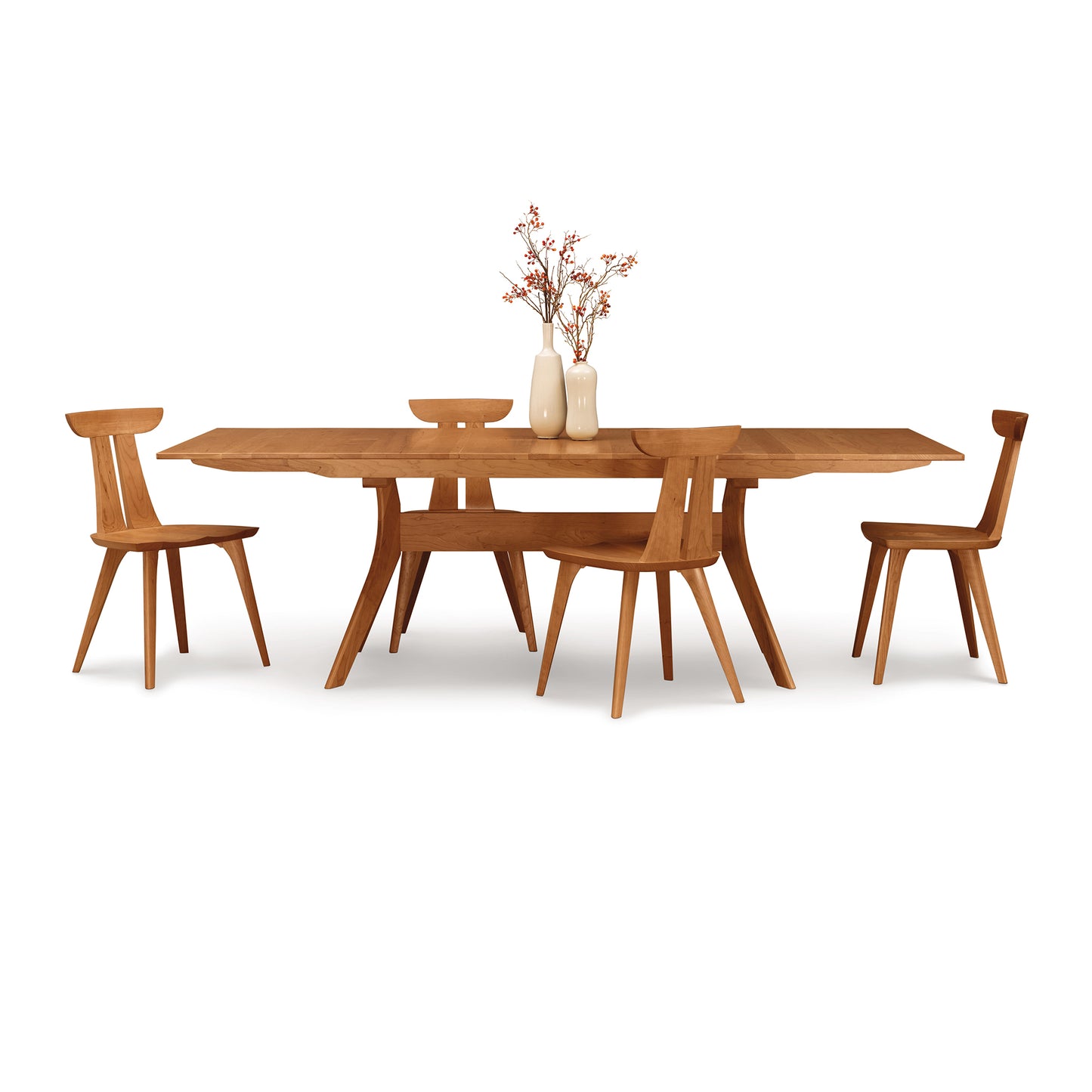 Copeland Furniture Audrey Extension Dining Table with four matching chairs, handcrafted in Vermont, displayed with simple tabletop decor.