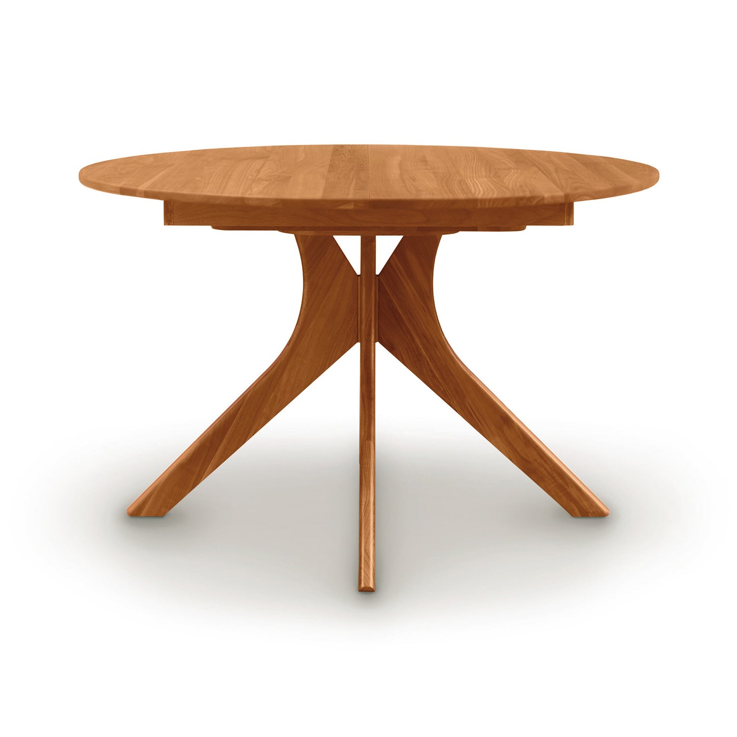 Audrey Round Extension Dining Table by Copeland Furniture with a solid wood top and distinctive geometric base, showcasing elegant American craftsmanship.