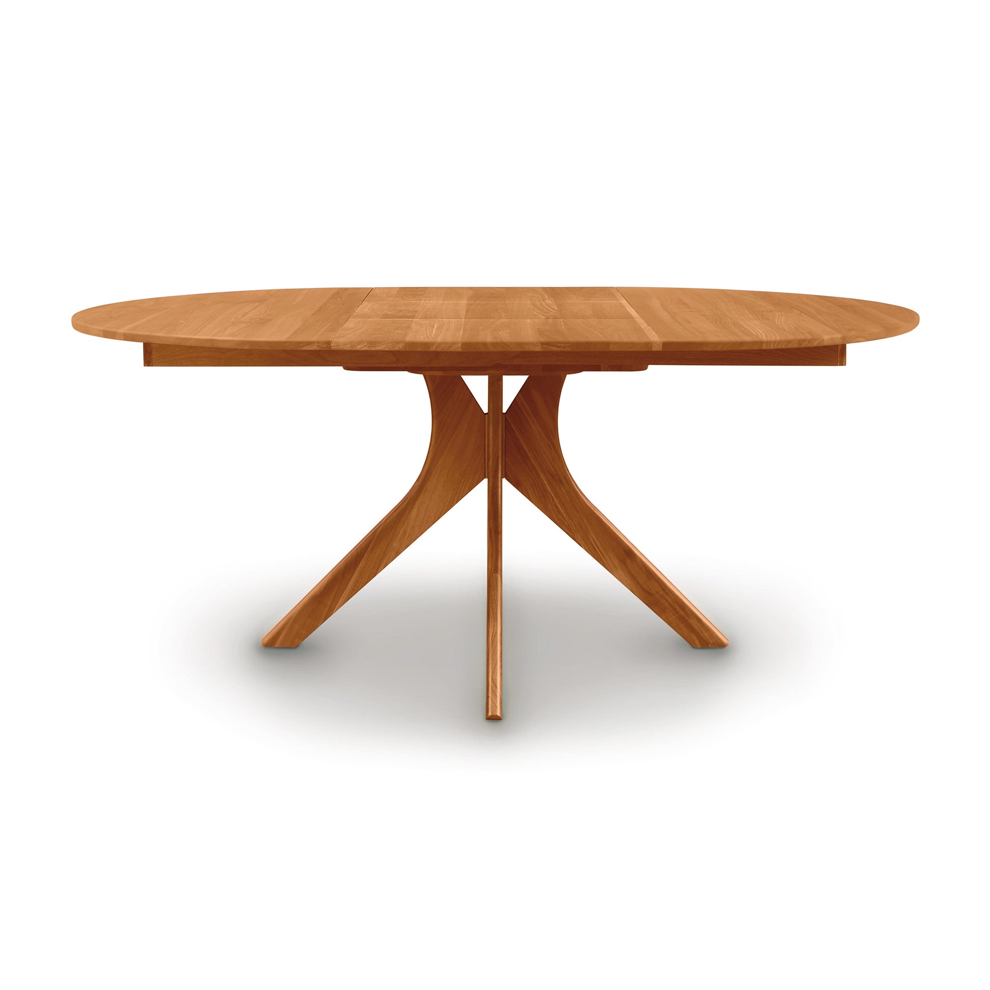 Audrey Round Extension Dining Table by Copeland Furniture with a modern wood top and tripod base, highlighting its craftsmanship and elegant design.