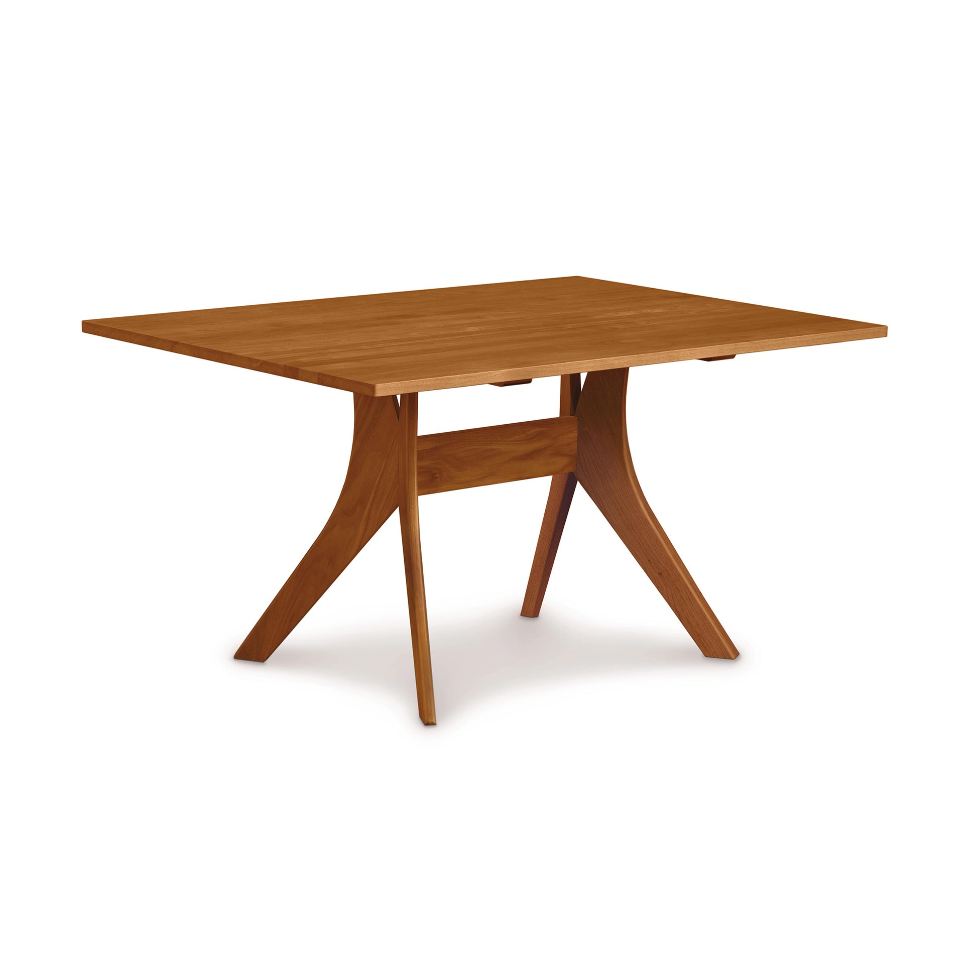 Audrey Solid Top Dining Table by Copeland Furniture with angled legs and a sleek, smooth top crafted from hardwood, highlighting its elegant design.