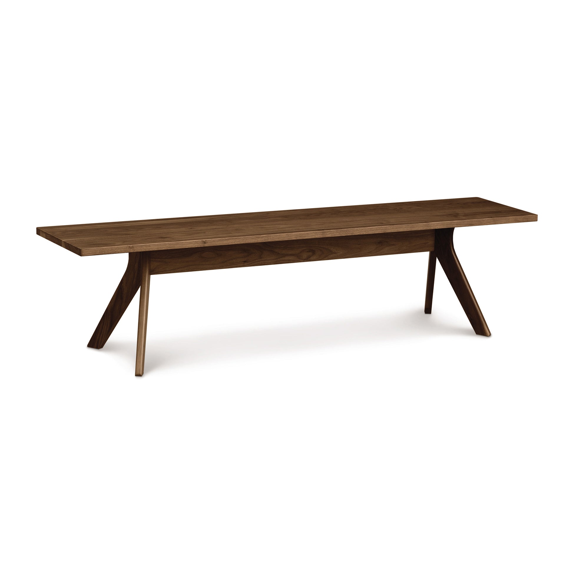 Audrey Dining Bench by Copeland Furniture with angled legs and a smooth cherry seat, showcasing its modern craftsmanship.