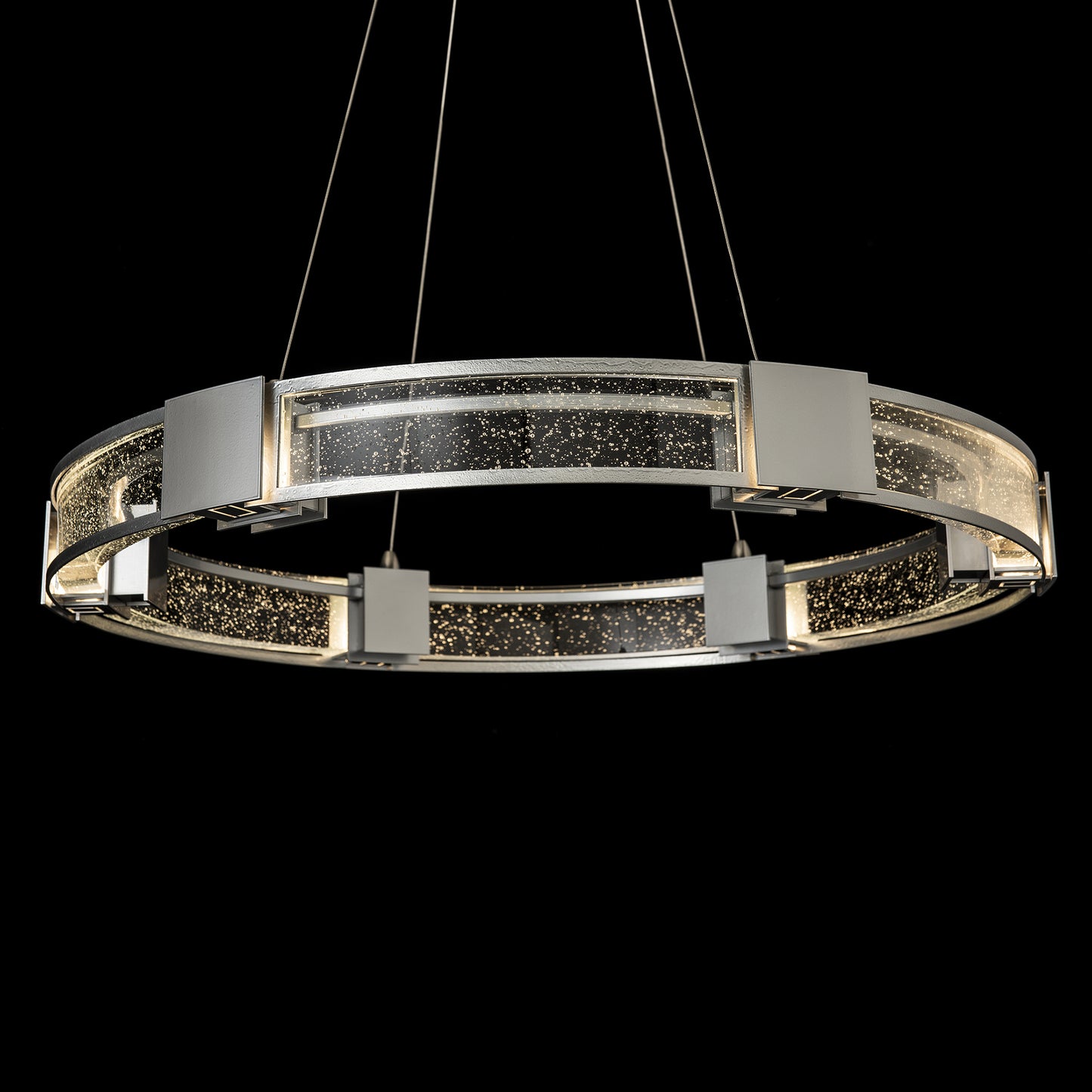Hubbardton Forge Aura Glass Pendant with circular design, metal accents, and bubble details.