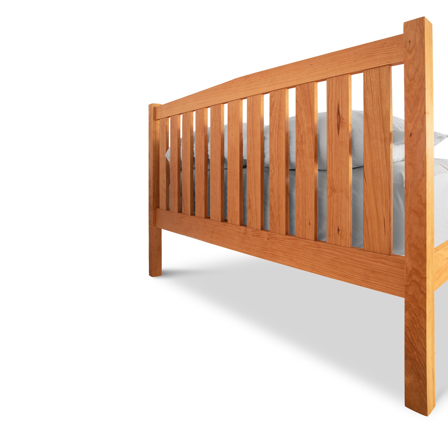 Bennington Bed with High Footboard by Vermont Furniture Designs, featuring vertical slats and solid wood craftsmanship, viewed from the foot.