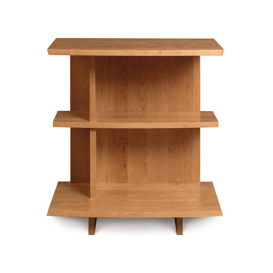 A symmetrical Berkeley Open Shelf Nightstand - Left with three shelves and angled legs, isolated on a white background by Copeland Furniture.