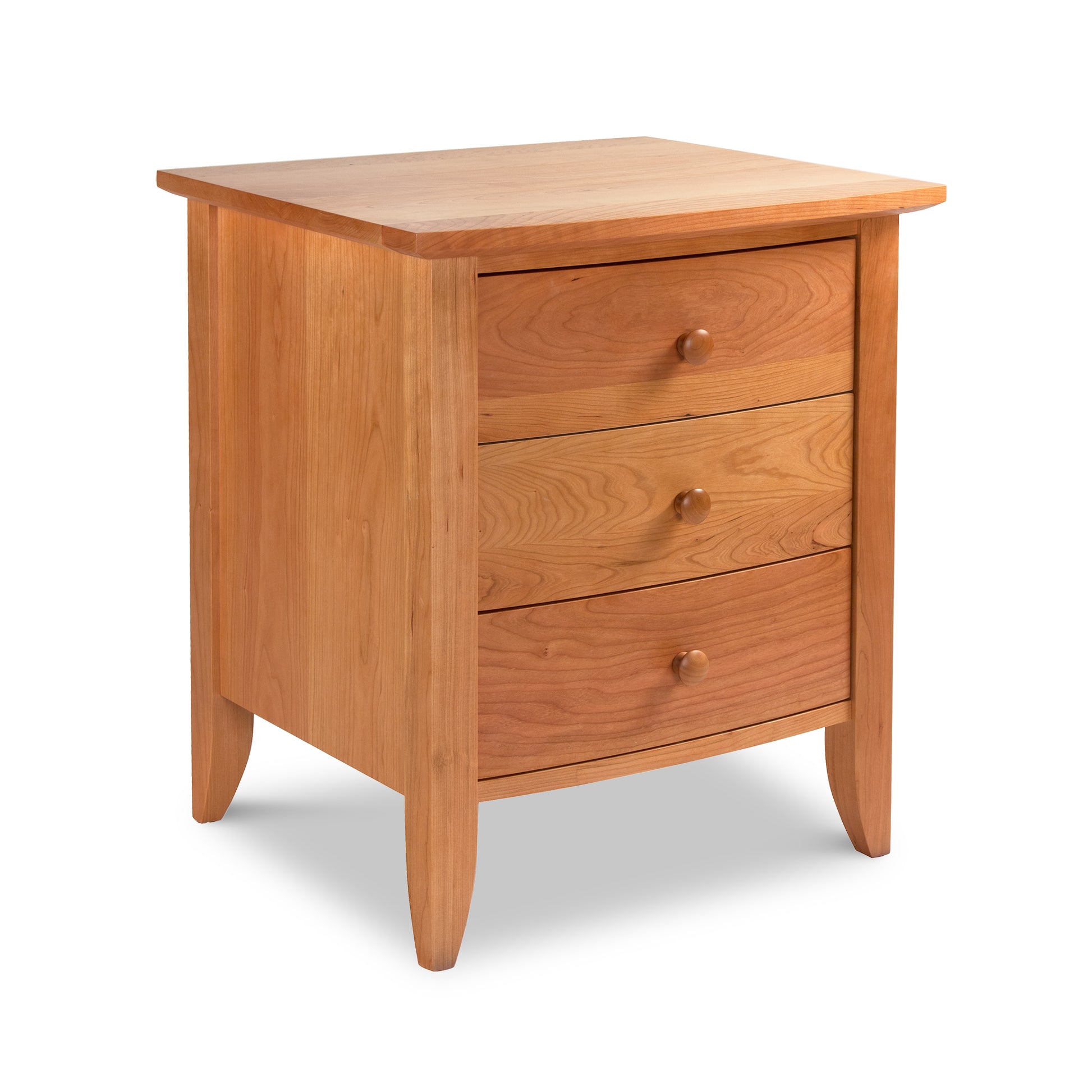 Bow Front 3-Drawer Nightstand by Lyndon Furniture with rounded knobs, handcrafted from wood in Vermont, shown featuring its elegant design and ample drawer storage.