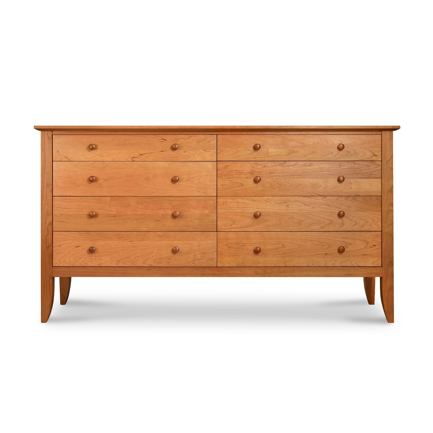 Lyndon Furniture Bow Front 8-Drawer Dresser with round knobs and tapered legs, crafted from sustainable wood in a modern style.