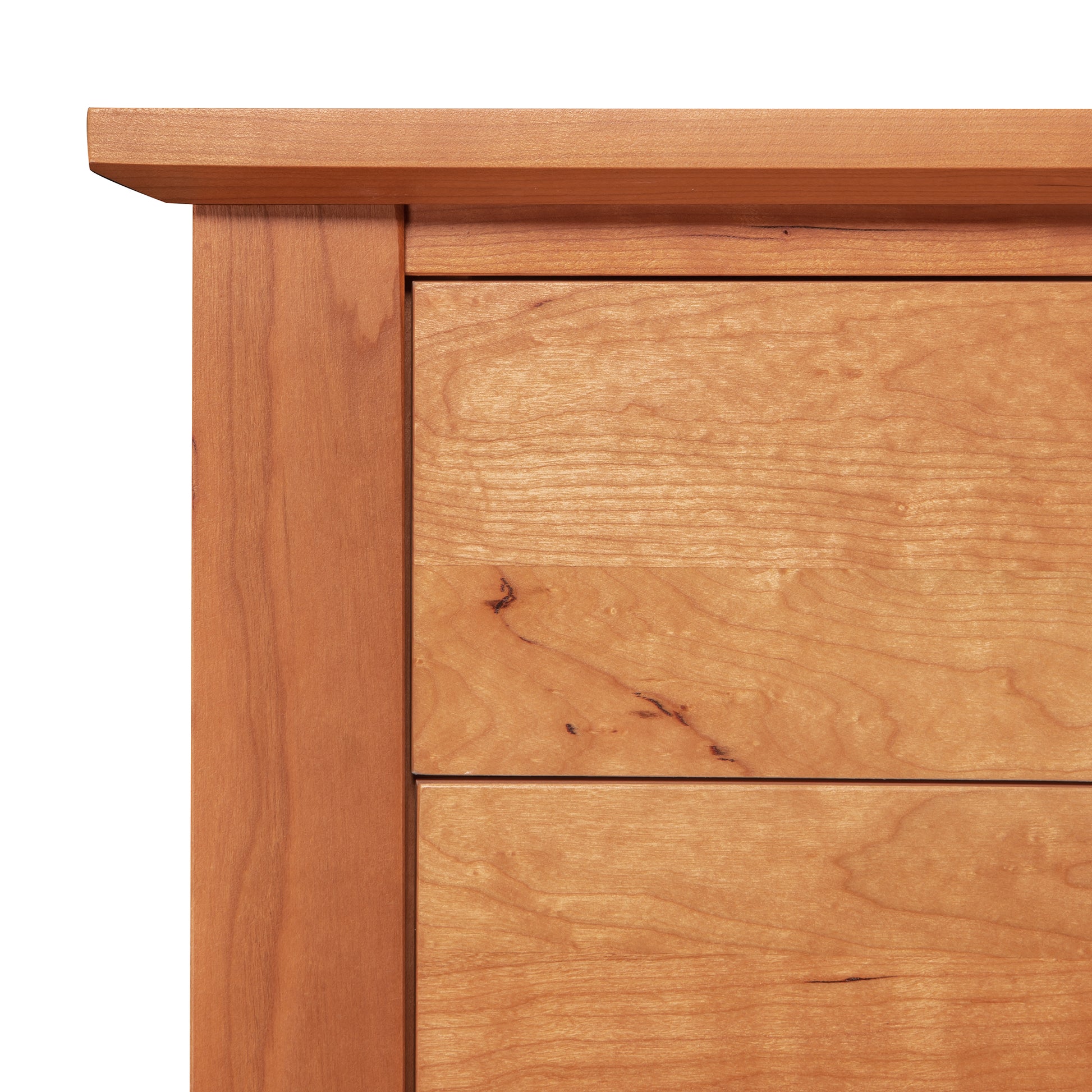 Detail view of the Lyndon Furniture Bow Front 8-Drawer Dresser, highlighting natural wood grain and two handcrafted drawer fronts.