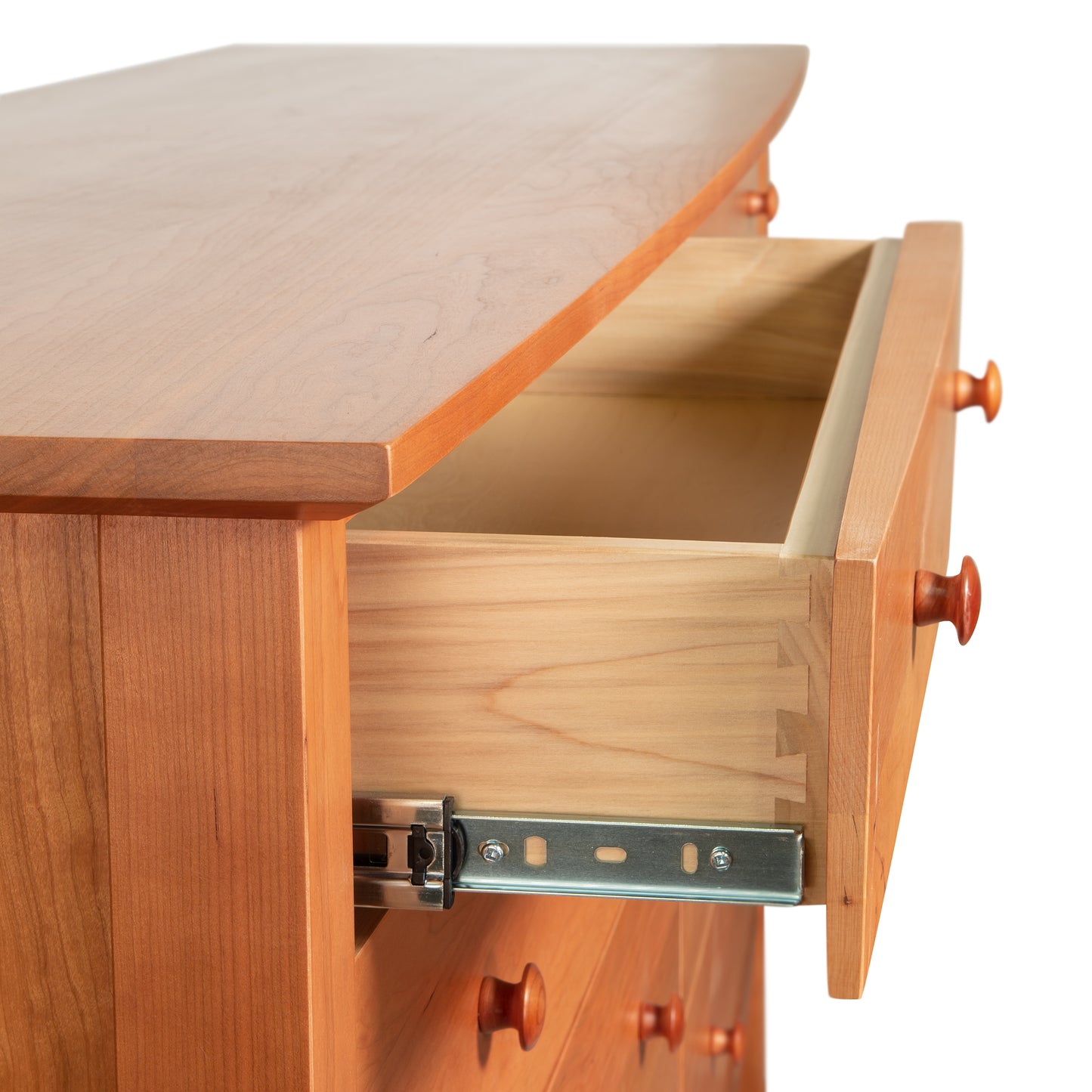 Lyndon Furniture Bow Front 8-Drawer Dresser featuring dovetail joints and metal slides, highlighting its craftsmanship and elegant design.