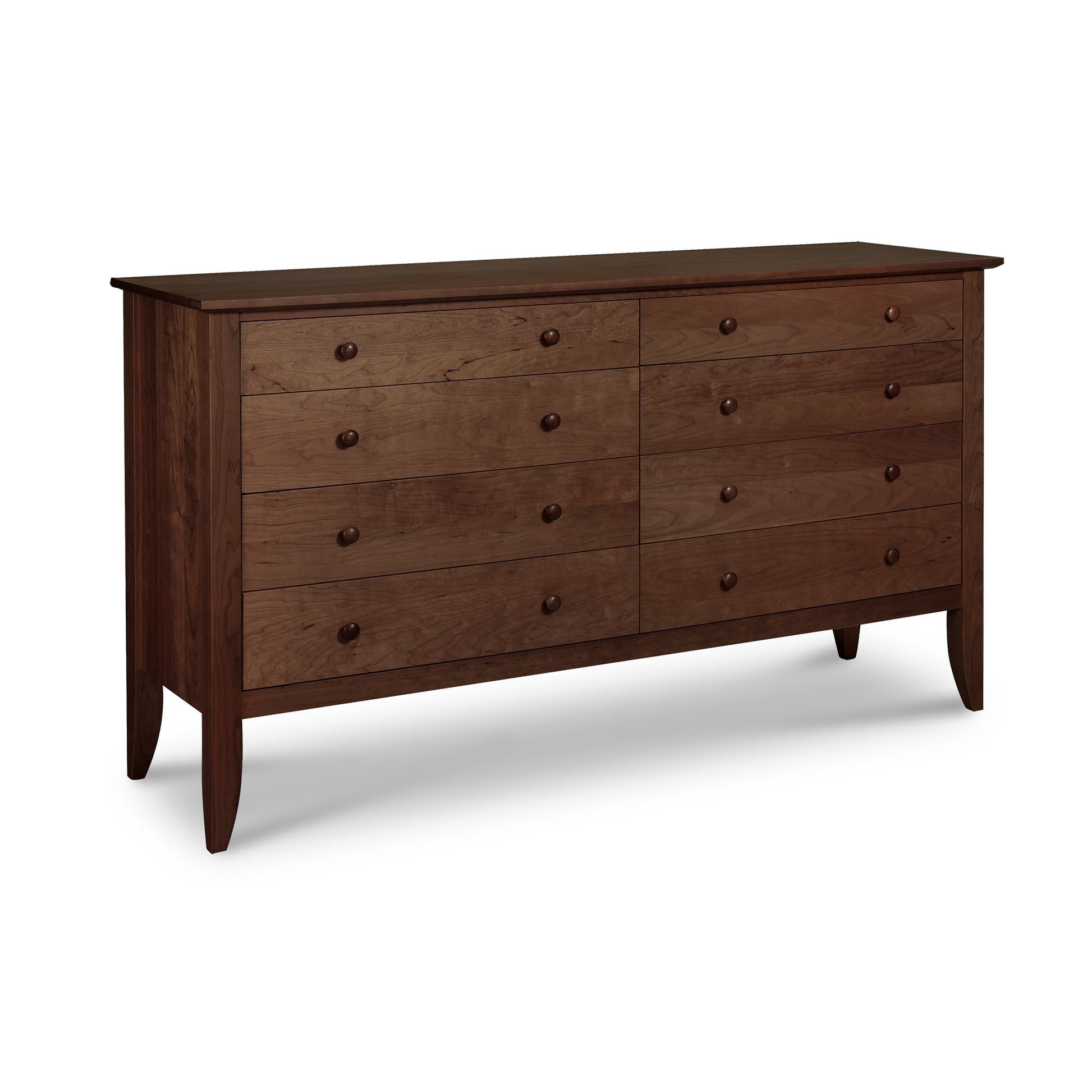 Lyndon Furniture Bow Front 8-Drawer Dresser crafted from sustainable wood with elegant tapered legs, showcasing modern American craftsmanship.