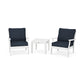 Two white POLYWOOD Braxton outdoor chairs with dark blue cushions and a small white side table, set against a plain white background.