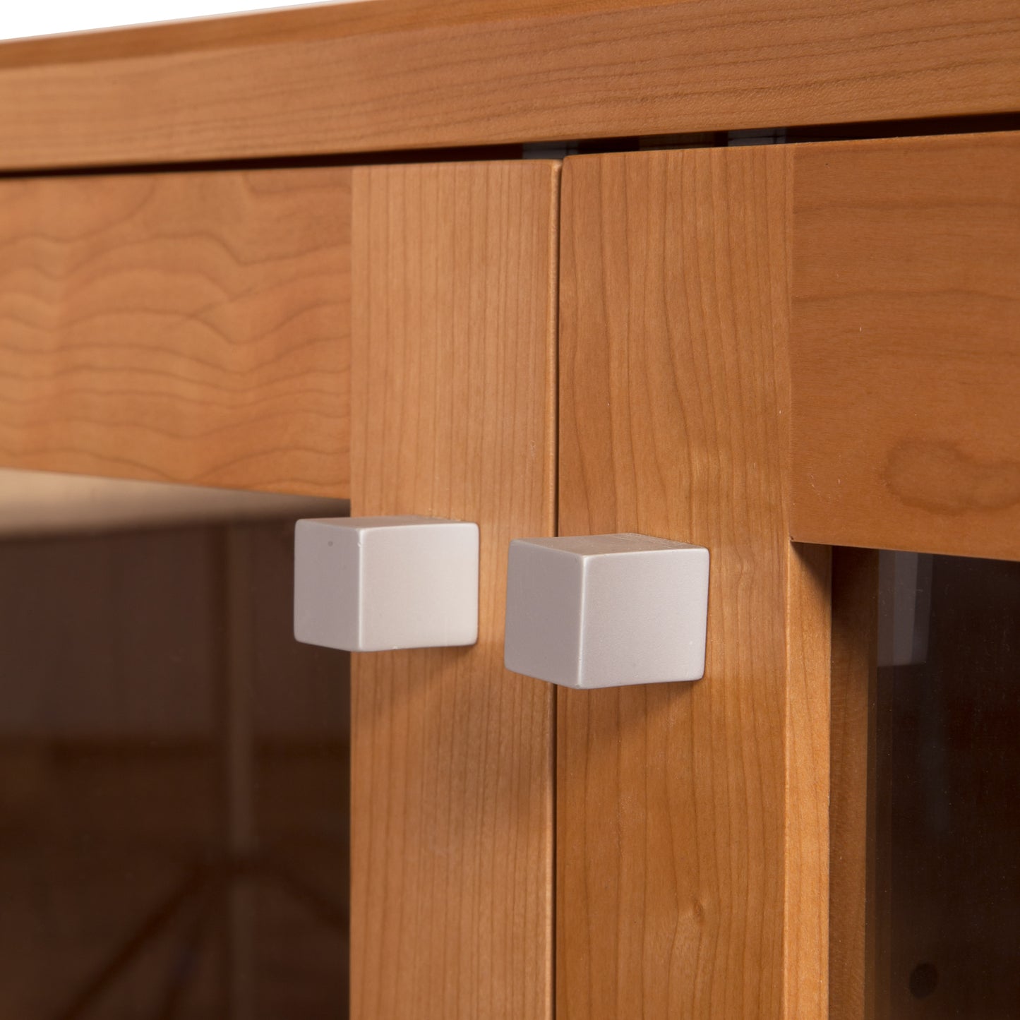 Close-up of Lyndon Furniture Brighton Buffet showcasing solid wood cabinet doors with glass panels and two square silver knobs.