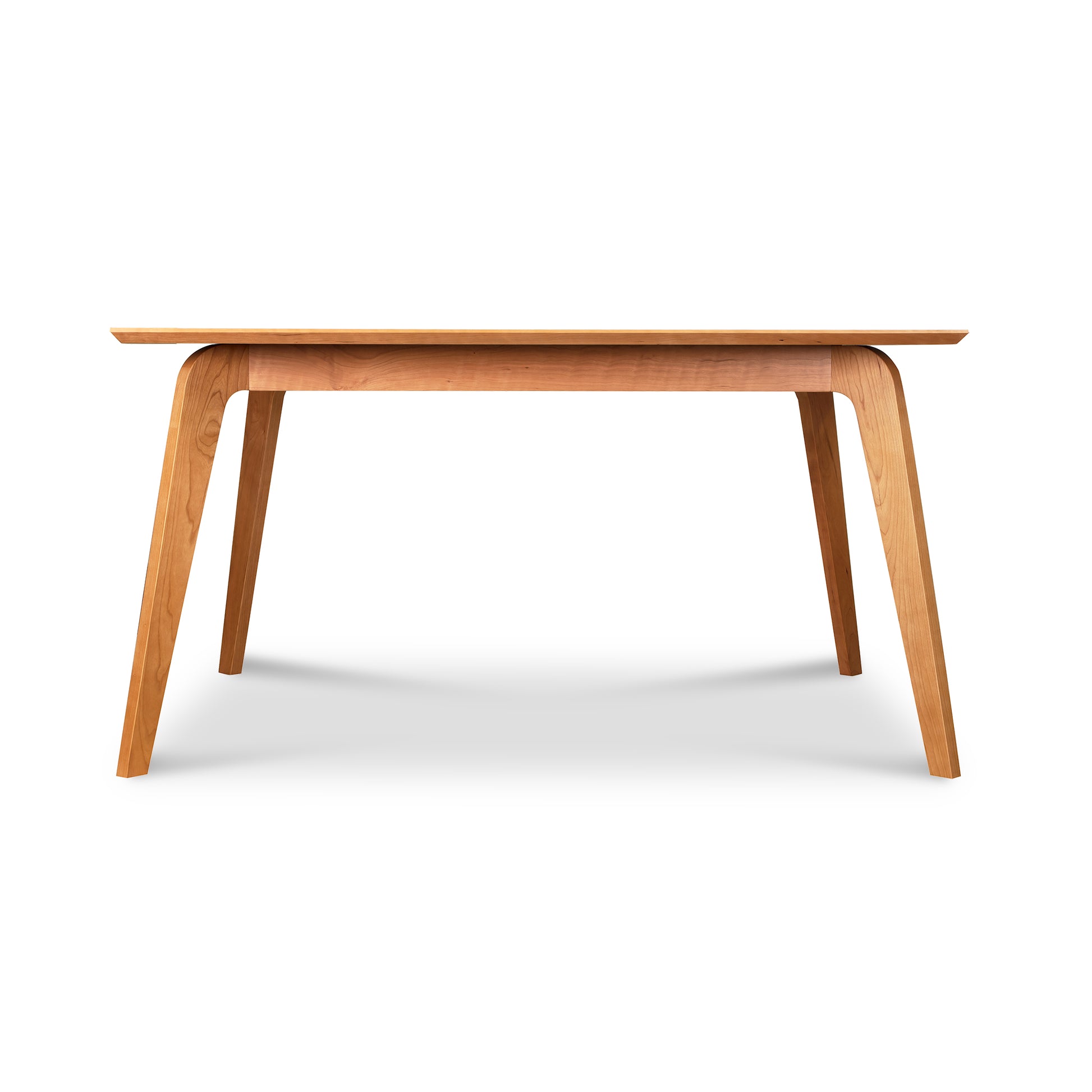 Brighton Solid-Top Table by Lyndon Furniture with angled legs and mid-century modern design, showcasing quality American craftsmanship.