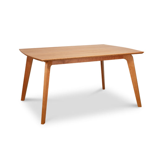 Lyndon Furniture Brighton Solid-Top Table with four angled legs and a smooth light brown finish, showcasing mid-century modern design.
