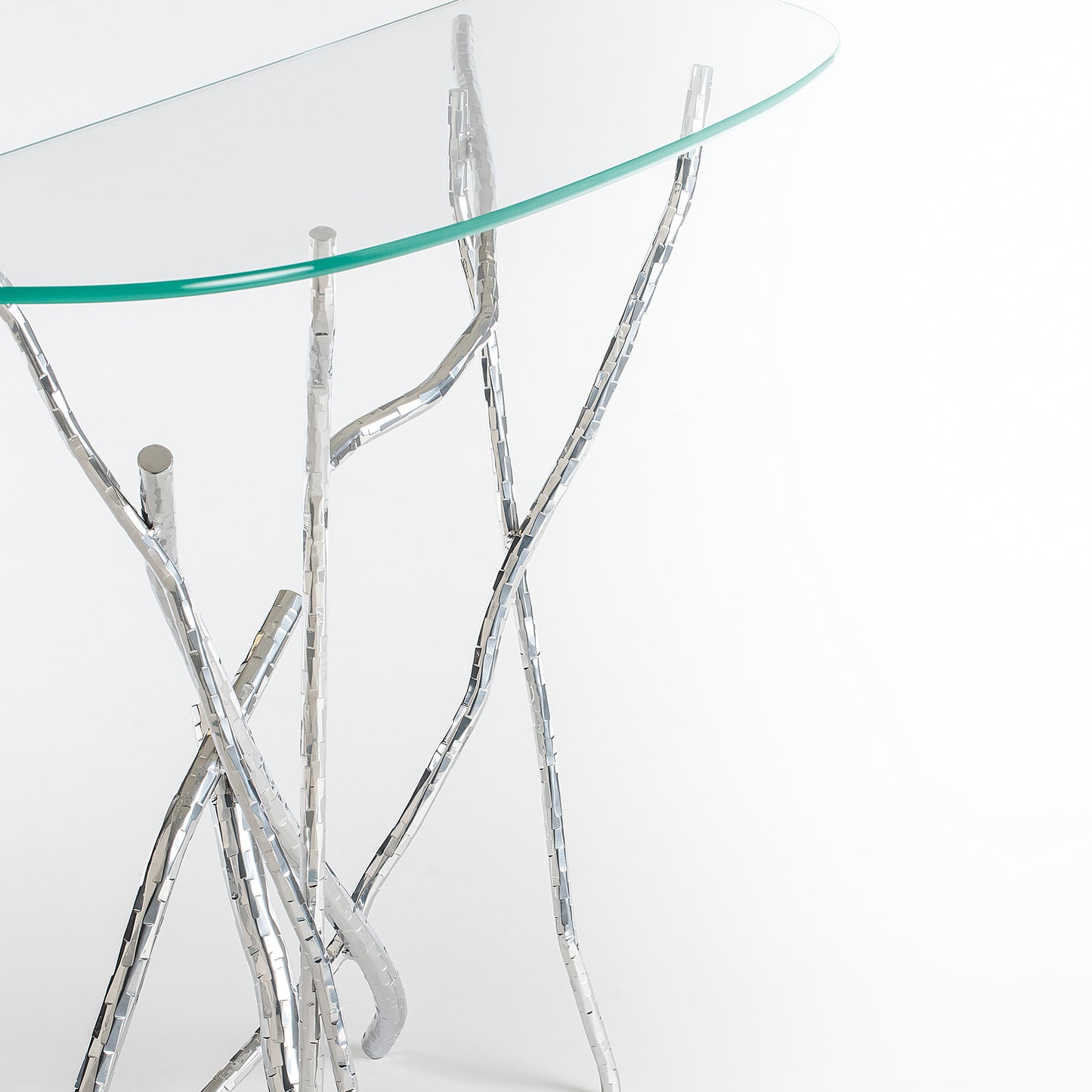 Brindille Console Table by Hubbardton Forge featuring a designer glass top and elegantly crafted hand-hammered metal branch legs.