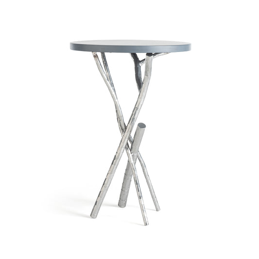 Brindille Wood Top Accent Table by Hubbardton Forge with dark gray top and three hand-hammered, branch-like steel legs.