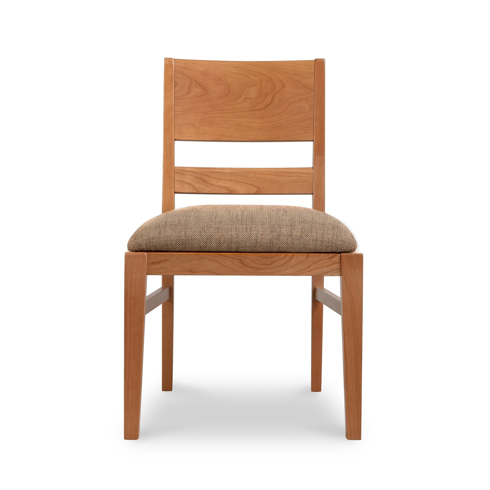 A wooden dining chair with a tan upholstered seat.