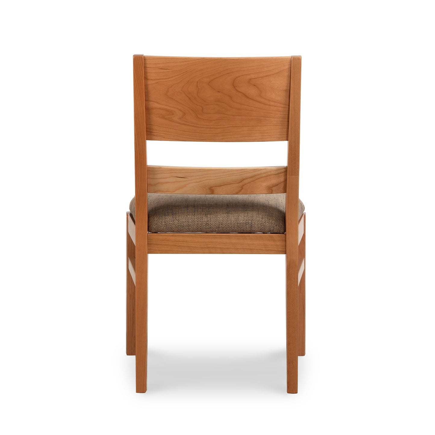 A wooden dining chair with a tan seat.