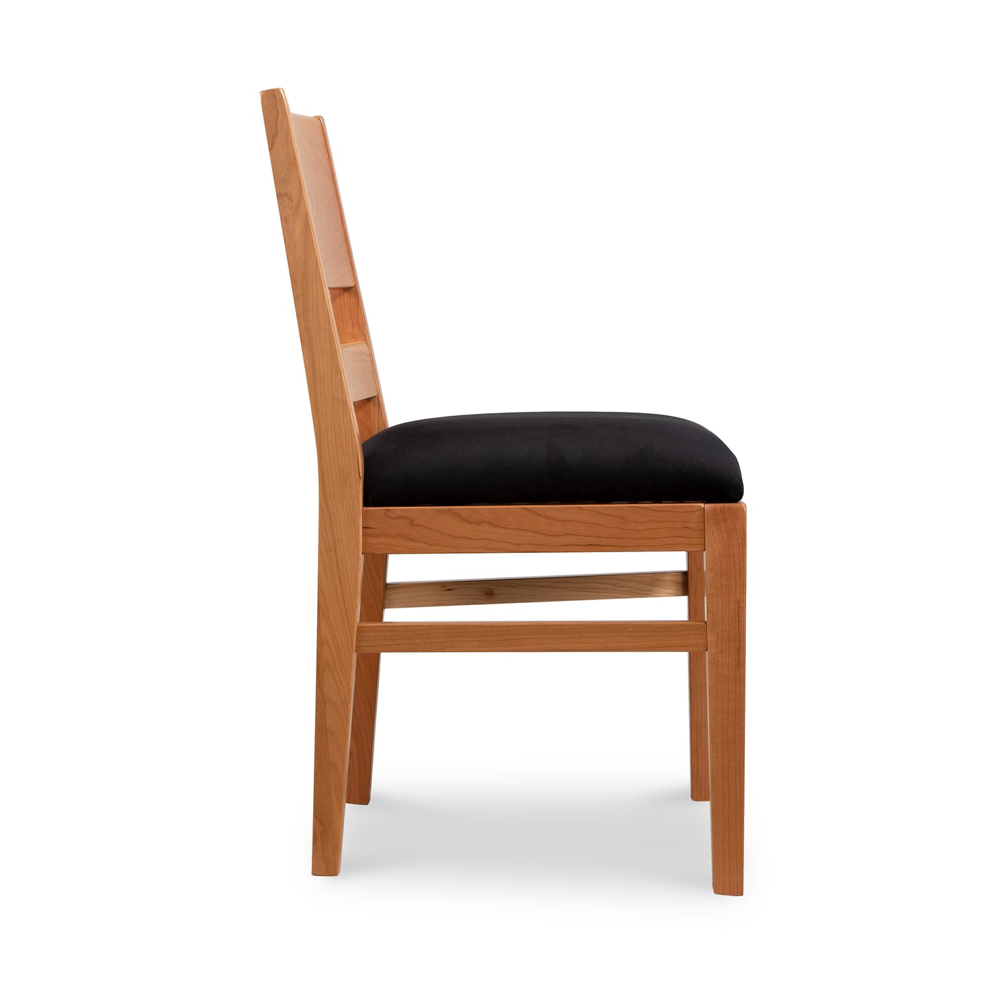 Burke Modern Chair by Vermont Woods Studios, featuring a black cushioned seat and straight backrest, shown from the side.