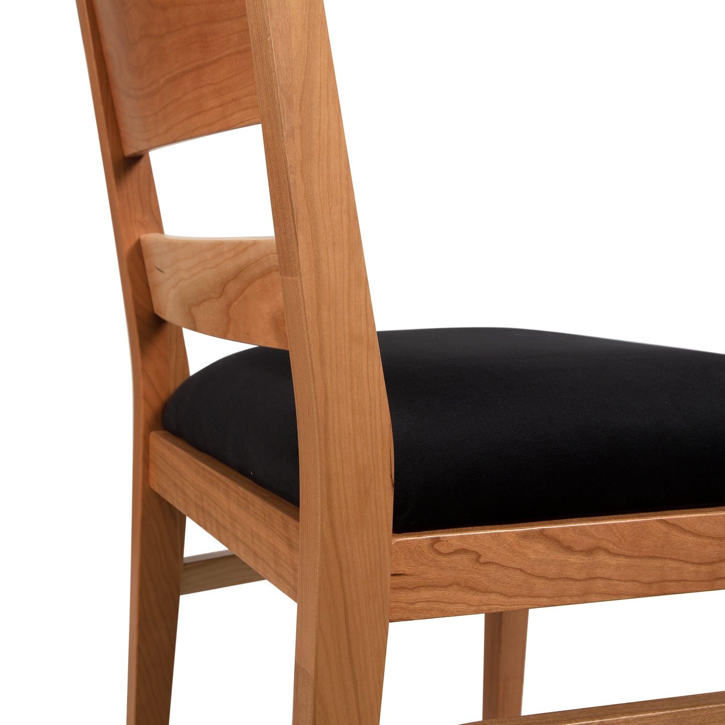 Burke Modern Chair by Vermont Woods Studios, 4-piece set featuring black cushioned seats and sleek wood frames, showcased against a simple white background.