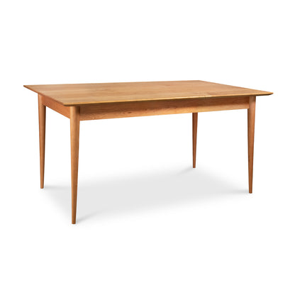 Crafted with meticulous craftsmanship, the Burke Modern Dining Table by Vermont Woods Studios showcases an exquisite wooden top.