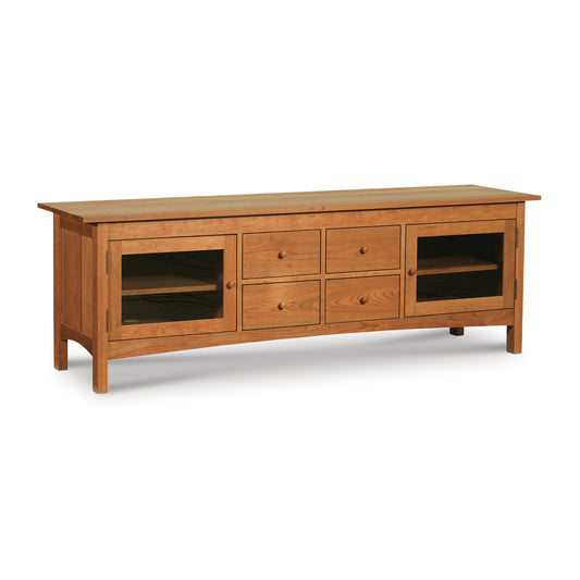 A Vermont Furniture Designs Burlington Shaker 4-Drawer Media Console with shelves and drawers on a white background.