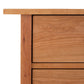 Corner of a Burlington Shaker 7-Drawer Chest from Vermont Furniture Designs with visible grain patterns.