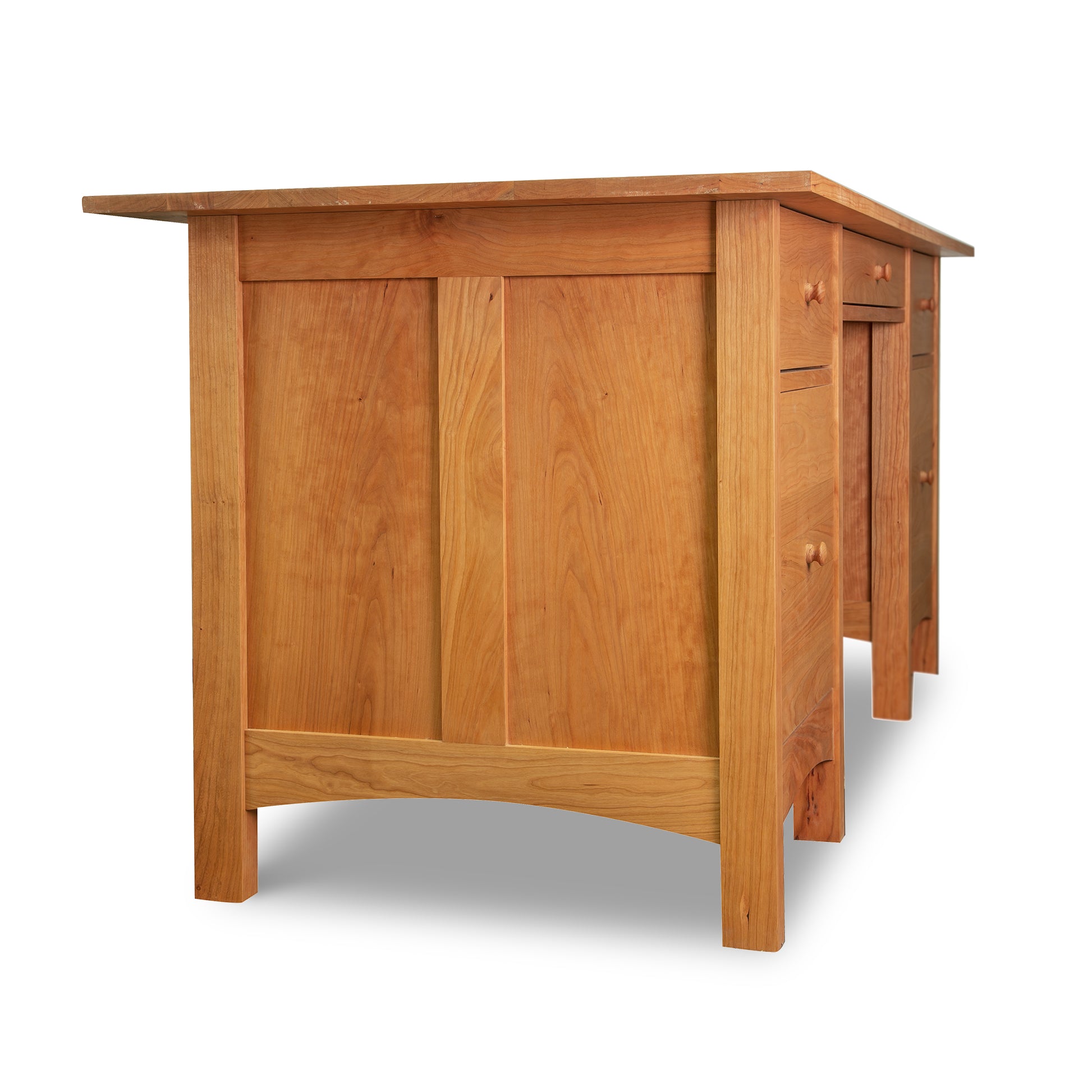 Handcrafted Burlington Shaker Executive Desk by Vermont Furniture Designs, made from solid wood with a smooth finish and intricate panel details, highlighting its drawers and side craftsmanship.