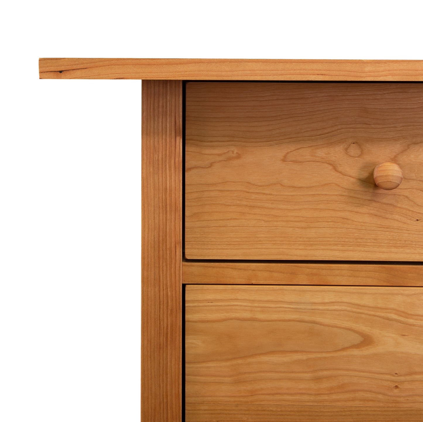 Burlington Shaker Executive Desk corner with two drawers, round knobs, and natural grain pattern; showcases solid wood craftsmanship and Shaker style design.