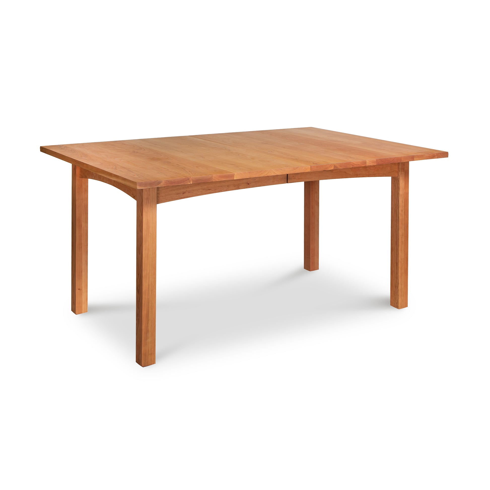 Burlington Shaker Extension Dining Table in natural cherry by Vermont Furniture Designs, featuring classic shaker lines and expert American craftsmanship.