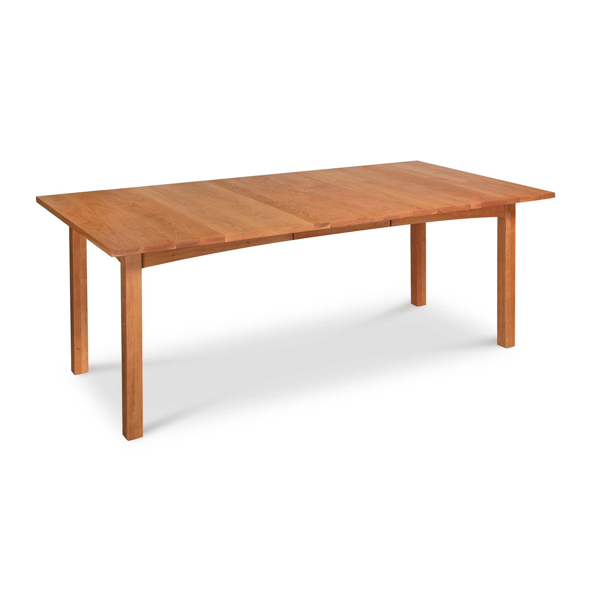 A Burlington Shaker Extension Dining Table - Floor Model with a smooth finish and simple, straight legs, crafted from solid hardwood construction by Vermont Furniture Designs, isolated on a white background.