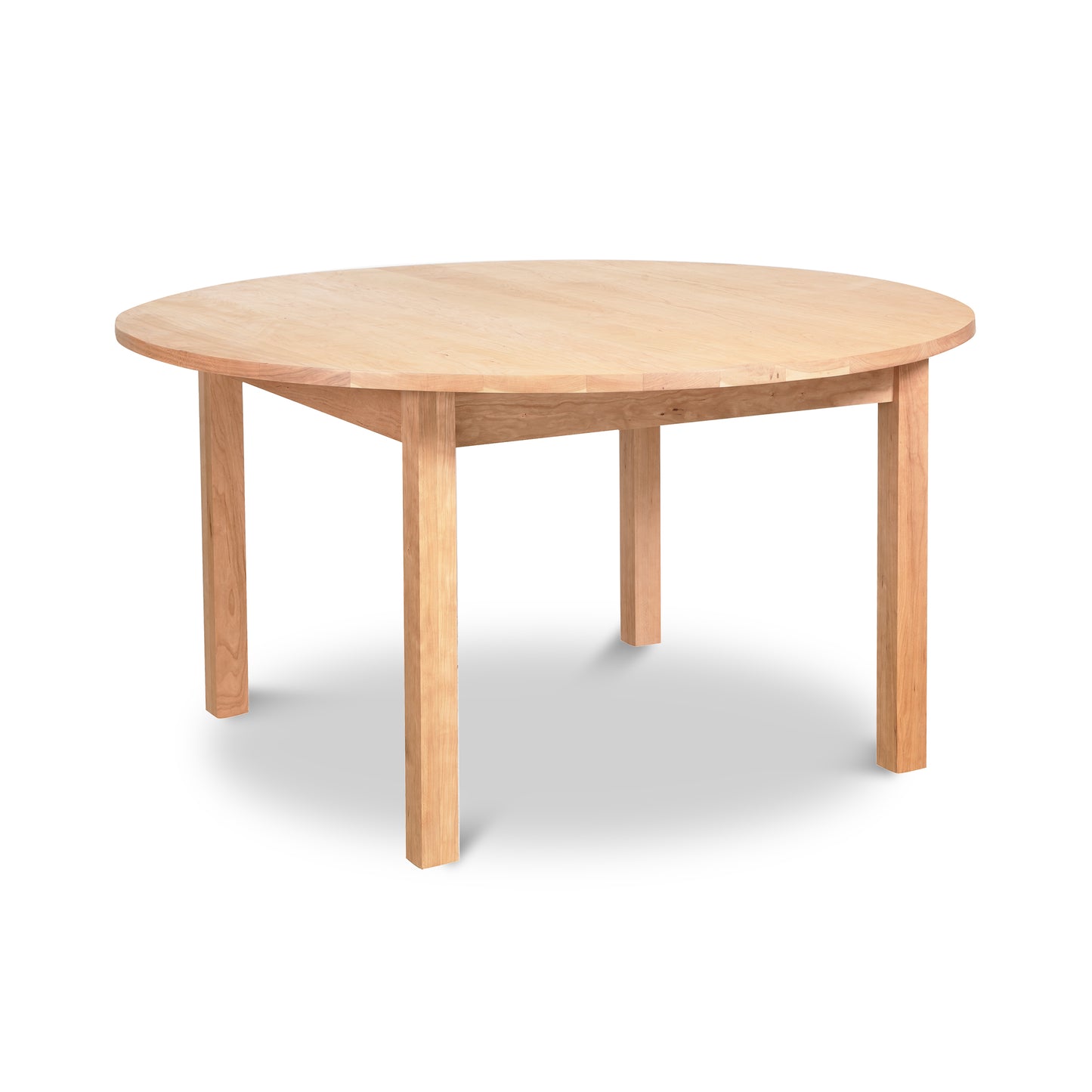 Burlington Shaker Round Solid Top Dining Table with four straight legs, crafted by Vermont Furniture Designs, shown clearly against a neutral background.