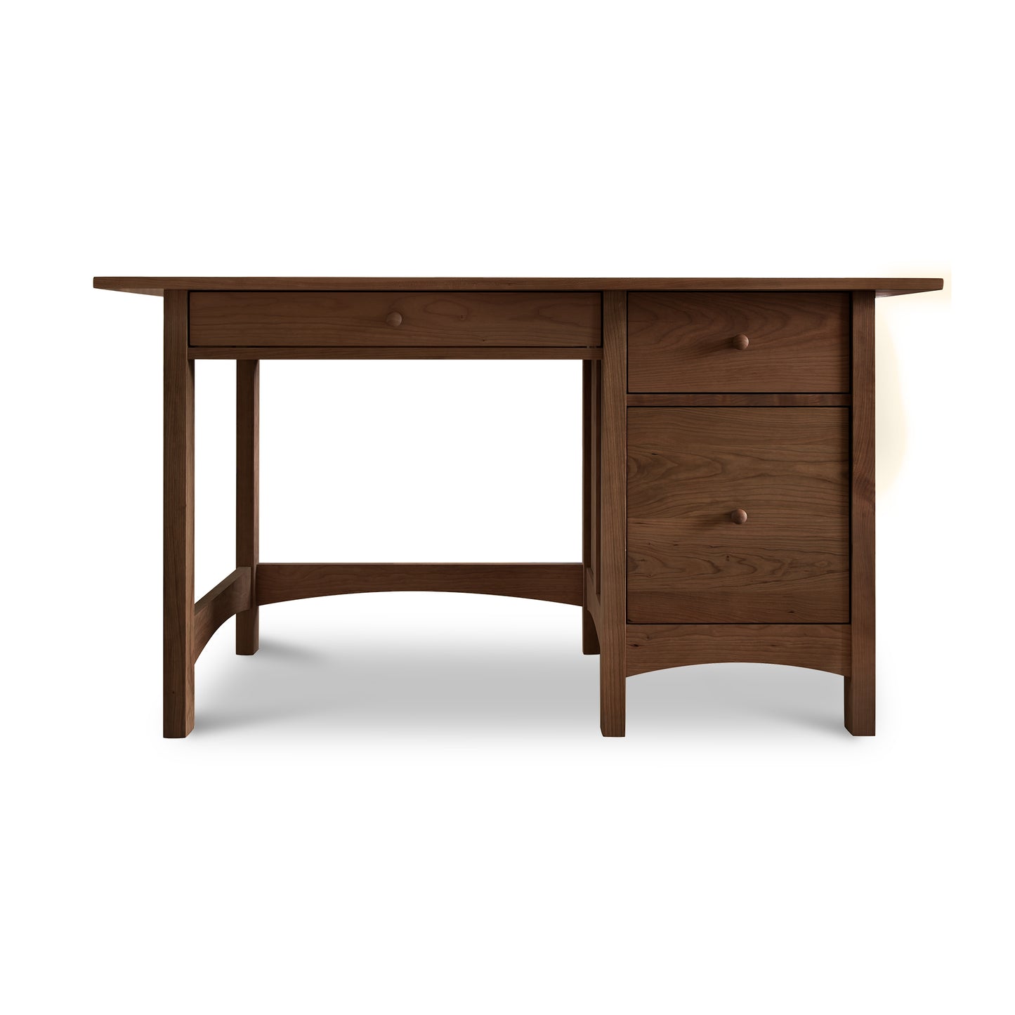 A handcrafted Vermont Furniture Designs Burlington Shaker Study Desk with two drawers on the right side, isolated on a white background.