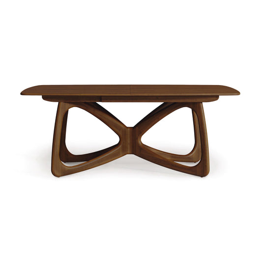 Butterfly Extension Dining Table in Walnut by Copeland Furniture, showcasing rounded edges and sculptural base, American made, on clearance.