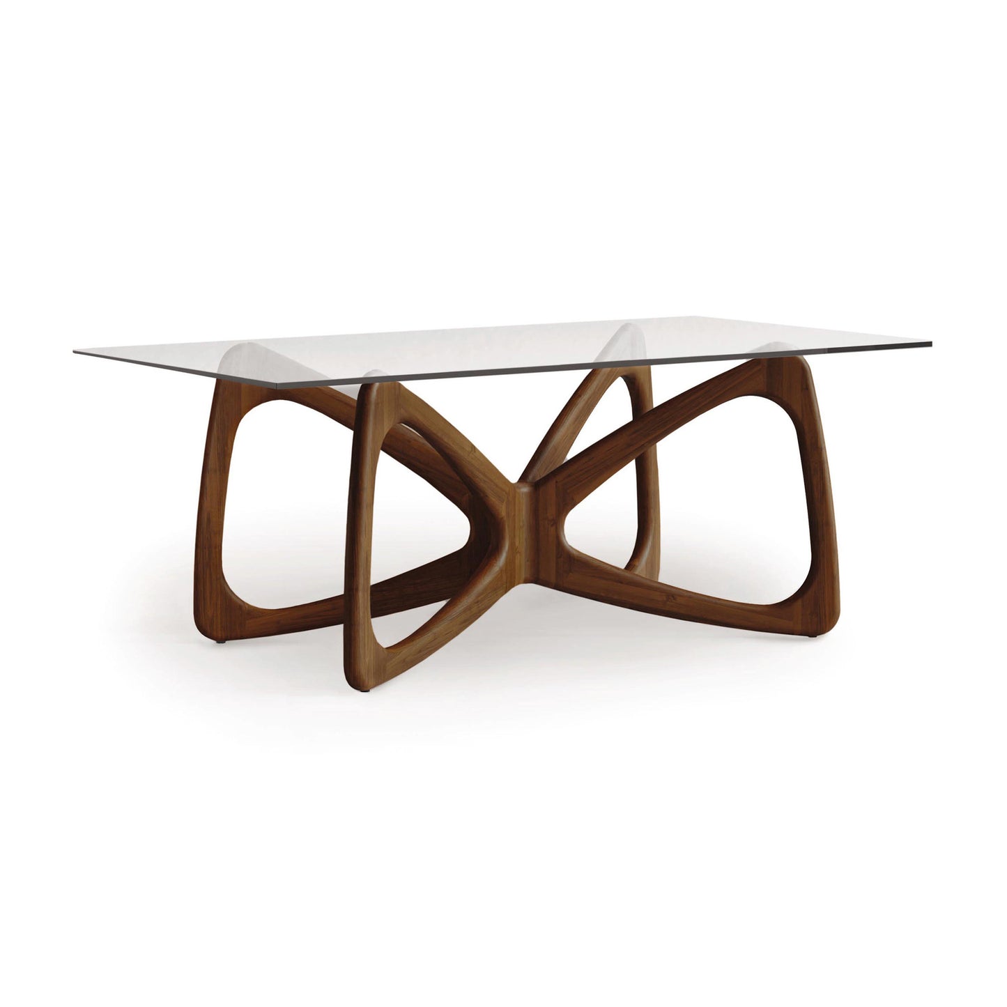 Butterfly Glass Top Dining Table by Copeland Furniture with a sculptural hardwood base and clear tempered glass top, showcasing elegant modern craftsmanship.