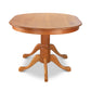 A wooden dining table with four Lyndon Furniture Cabriole Oval Double Pedestal Solid Top Table feet.