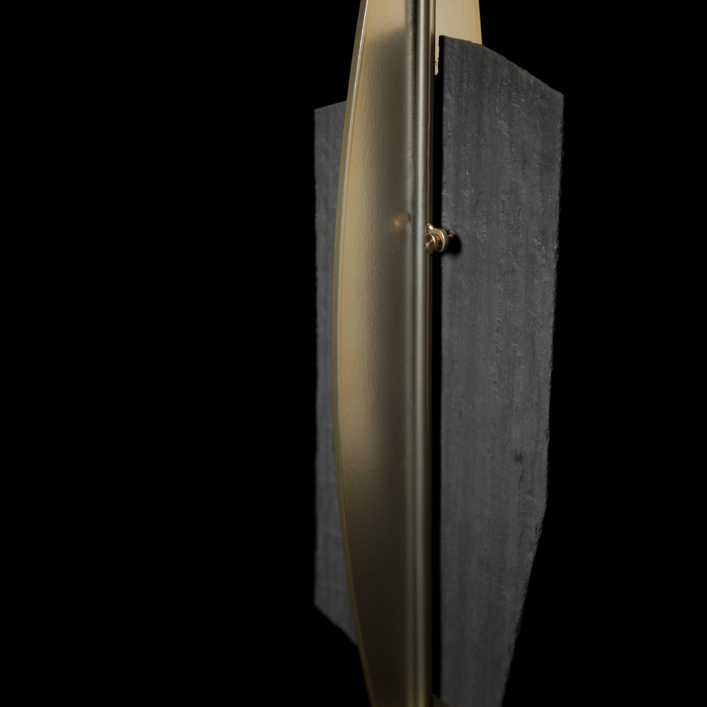Cambrian Table Lamp by Hubbardton Forge featuring a textured black panel, floor model, focus on lamp design.