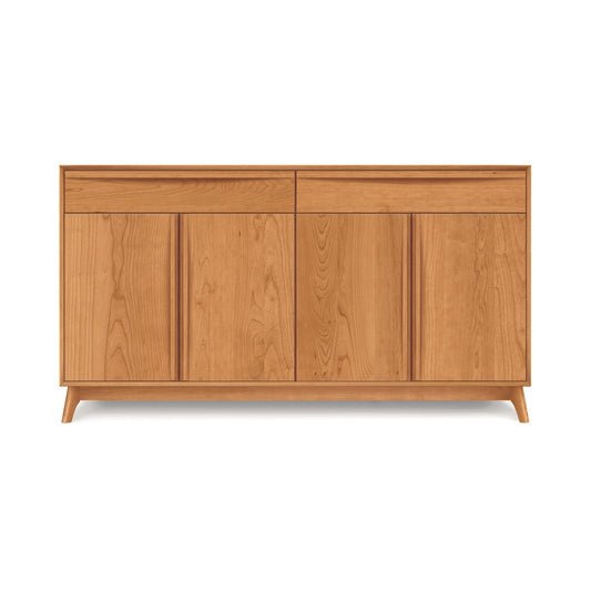 Modern solid wood sideboard with closed doors and tapered legs on a plain background, handcrafted in Vermont as part of the Copeland Furniture Catalina Buffet collection.
