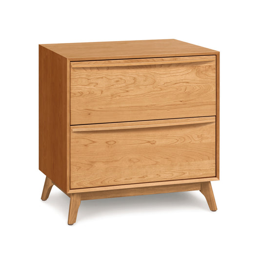 A solid natural hardwoods Copeland Furniture Catalina 2-Drawer Nightstand with angled legs, isolated on a white background.