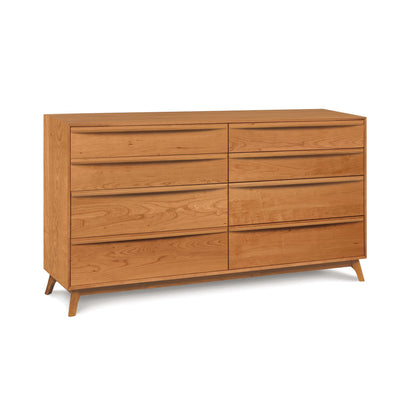 A solid hardwood eight-drawer dresser with angled legs from the Catalina furniture collection, set against a white background by Copeland Furniture.
