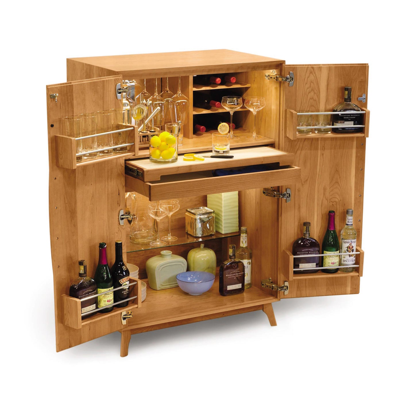 A Copeland Furniture Catalina Bar Cabinet, fully stocked with various bottles, glasses, and bar tools, with open doors revealing an assortment of alcoholic beverages and wine storage accessories.