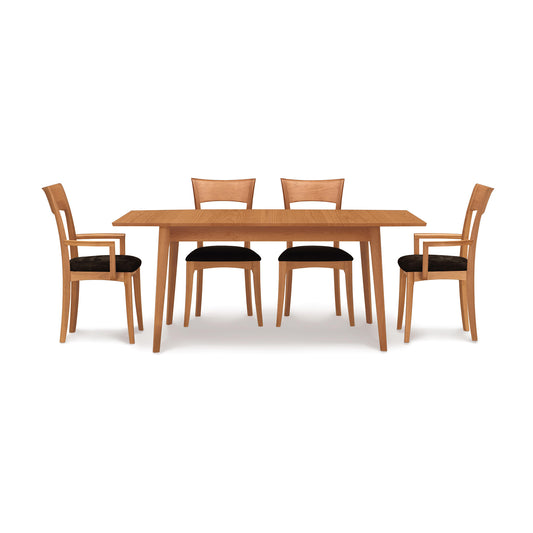 A Catalina Extension Table dining table set with four Copeland Furniture chairs on a white background.