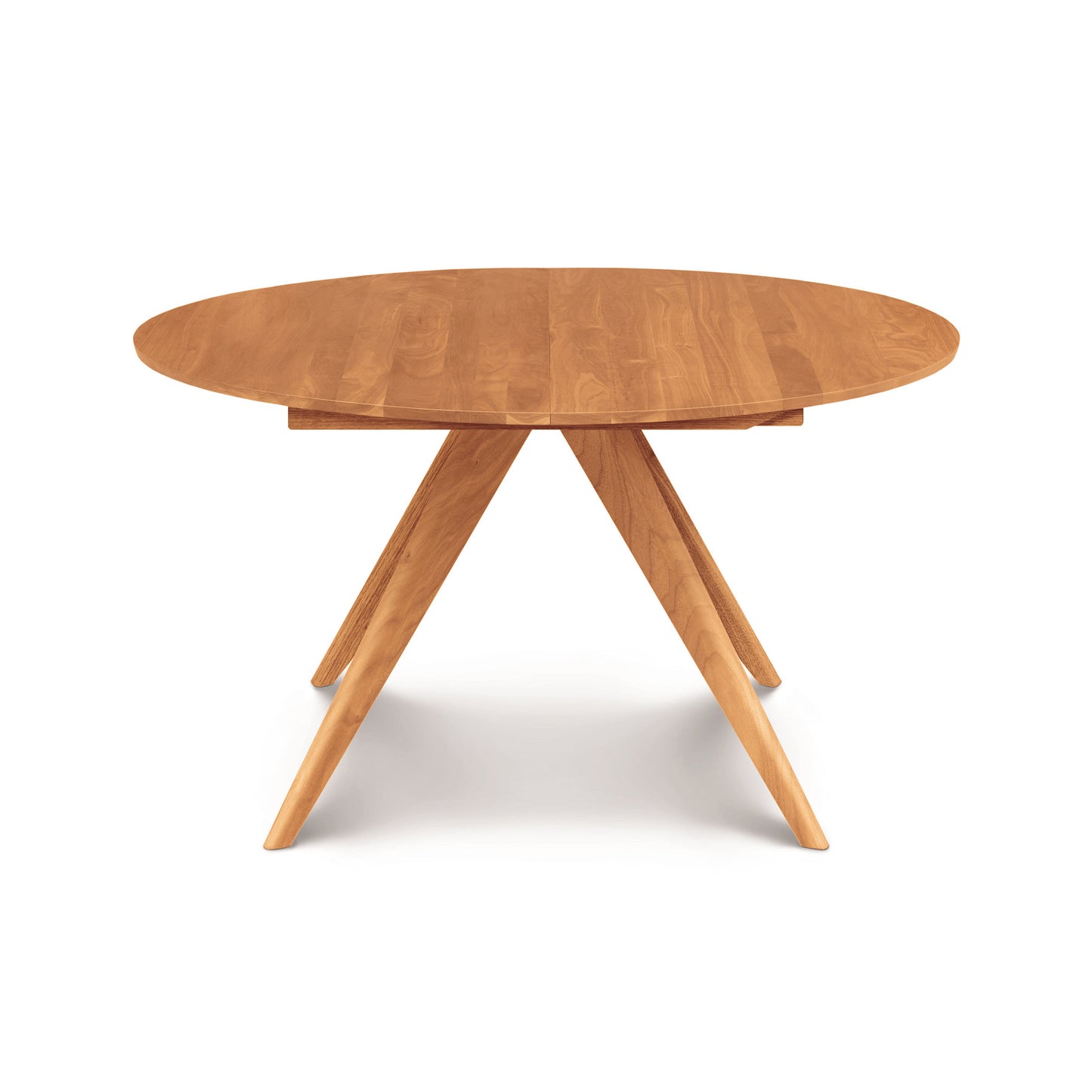 Catalina Round Extension Table by Copeland Furniture, crafted from solid North American wood with four angled legs, showcased for its quality and design.
