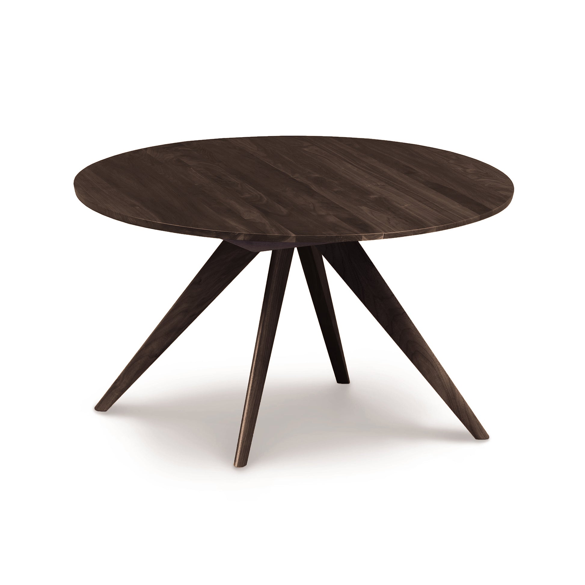 Solid wood Copeland Catalina Round Extension Table with a smooth top and angled legs, highlighting craftsmanship and design.