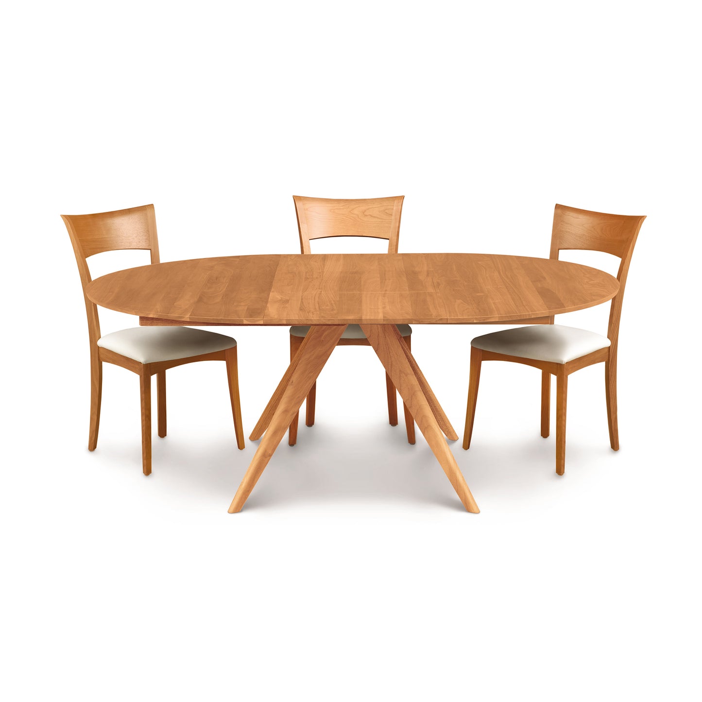 Copeland Catalina Round Extension Table with angled legs and three cushioned chairs, highlighting the modern wood furniture design.